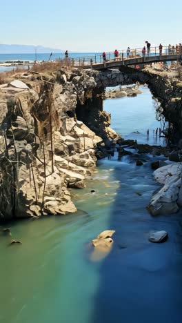 destruction of bridge reveals river and urban decay in coastal town
