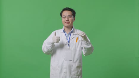 scientist holding a test tube with orange liquid