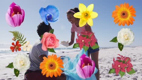 Animation-of-flowers-over-happy-african-american-man-and-woman-picking-up-rubbish-from-beach