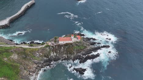 Faro-de-Cudillero,-Spain-old-lighthouse-drone,aerial