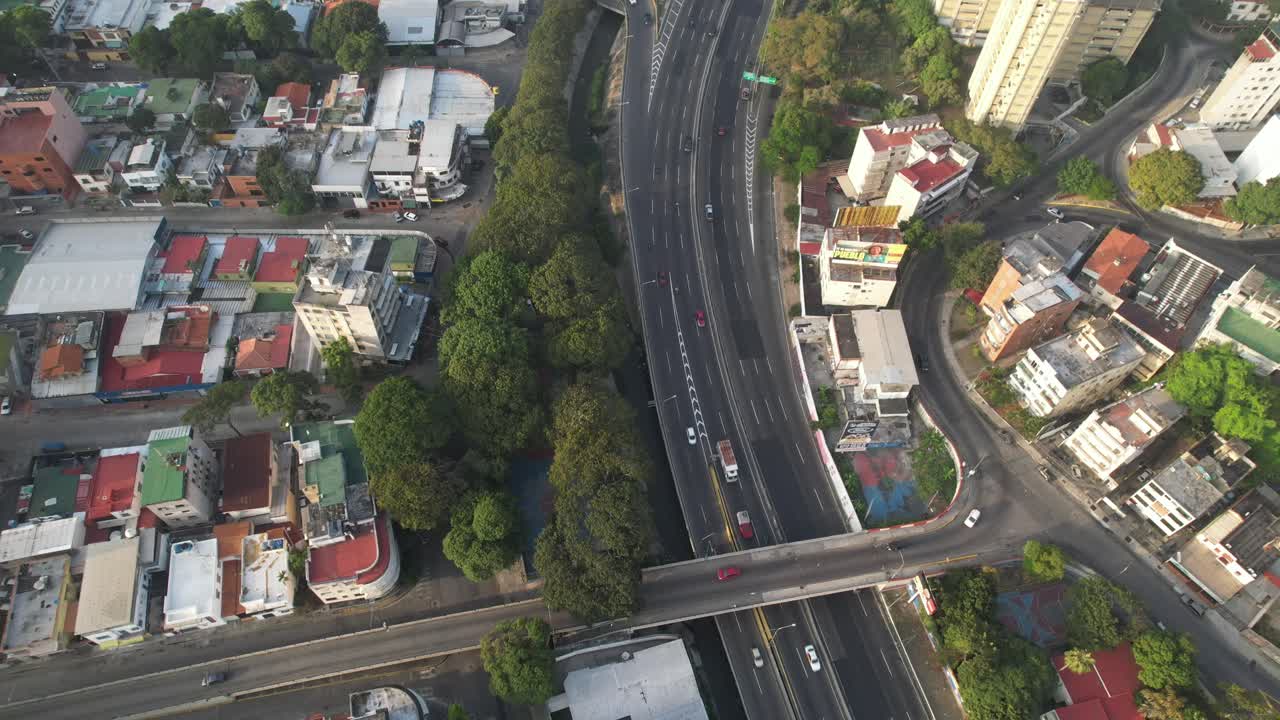 Caracas with san pedro bridge, lush greenery, and urban streets , aerial view