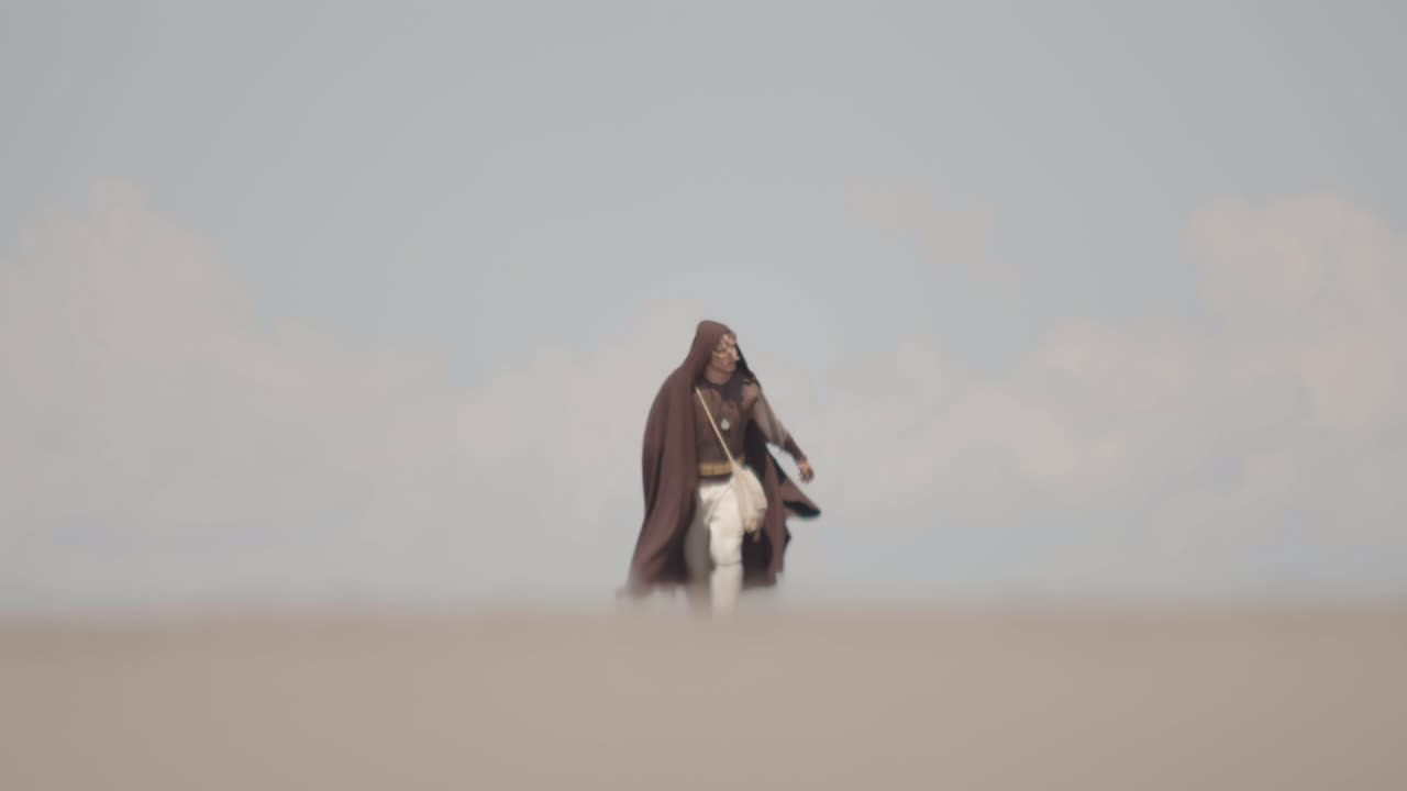 A lone, robed character battles against strong wind and haze while walking through a barren landscape. A cinematic concept of struggle, perseverance, and a difficult journey