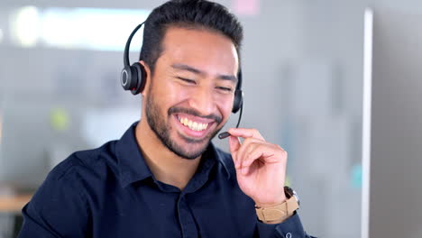 Call-center-agent-talking-on-headset-while-working