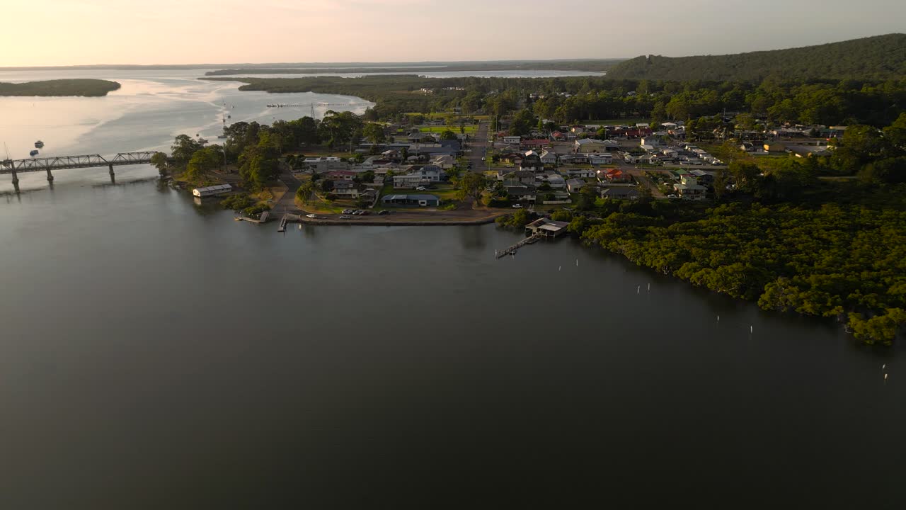 Left to right sunrise aerial view of the regional town of Karuah, New South Wales, Australia.