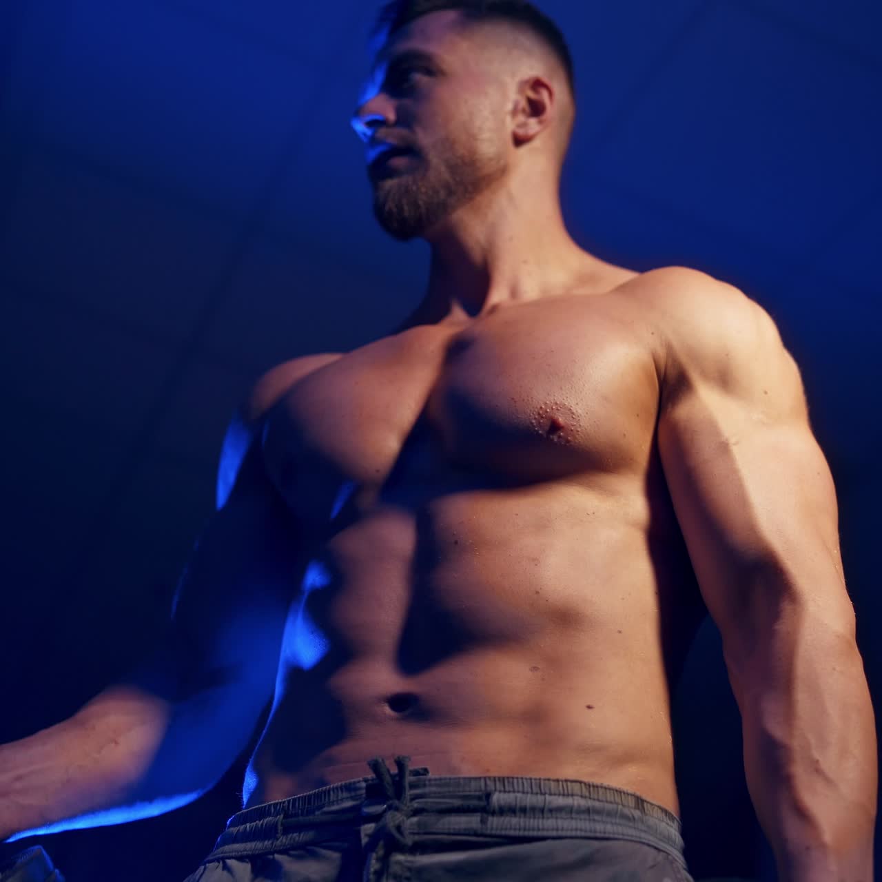 Muscular man working out in gym