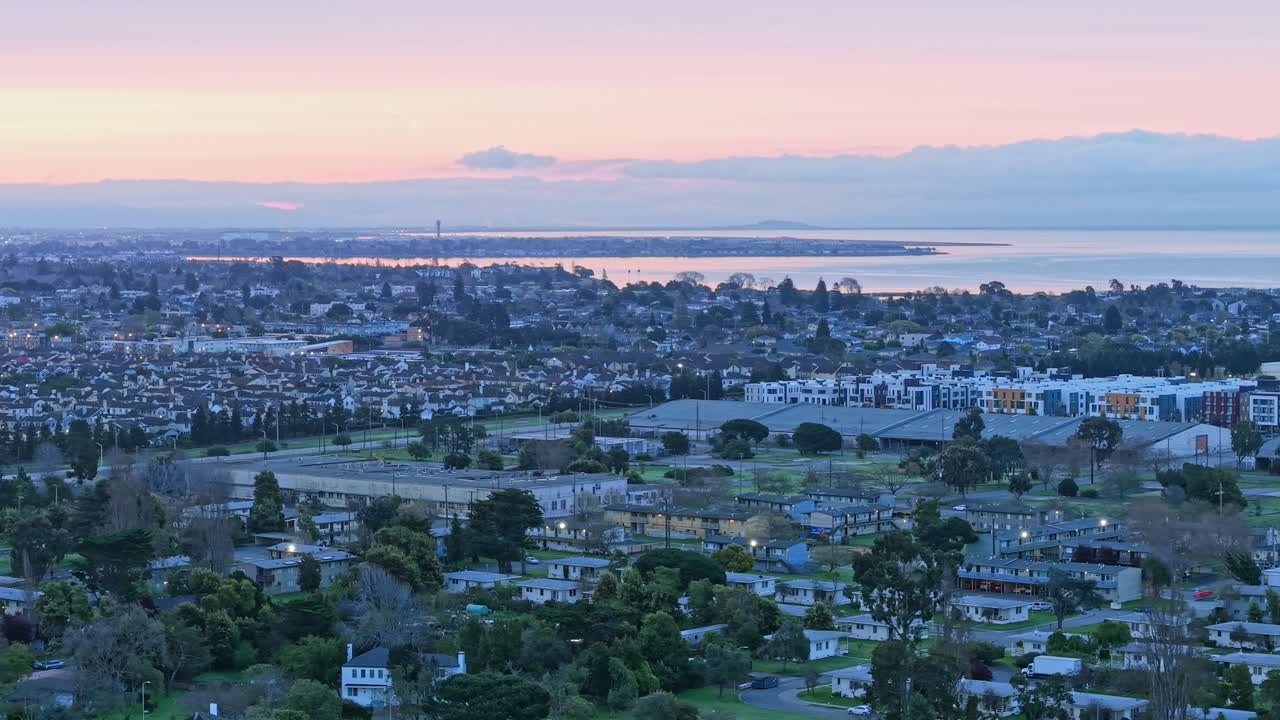 A rotating left to right panning shot of the residential neighborhood in western Alameda California. Shot on the DJI Air 3S drone.