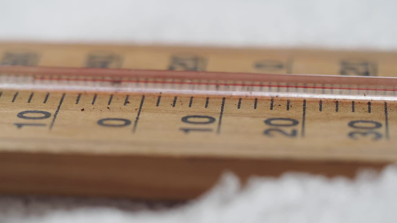 Wooden Thermometer Showing Temperature Around Zero Degrees