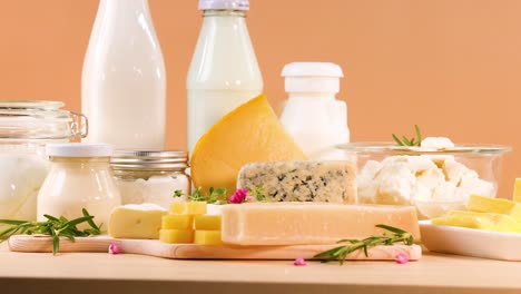 assorted dairy products on an orange background