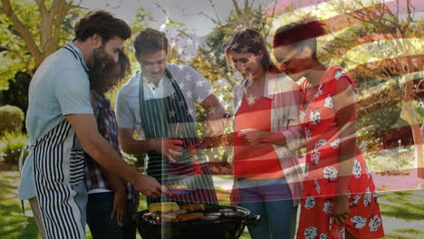 animation of flag of usa over diverse group of friends having party outdoors