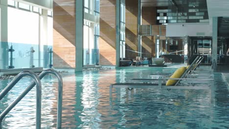 View-of-rooftop-swimming-pool-with-sunshine-shines-on-water-surface