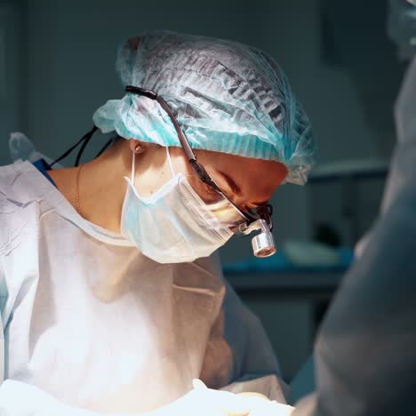 plastic surgeon performs an operation for abdominoplasty with a transfer of the navel