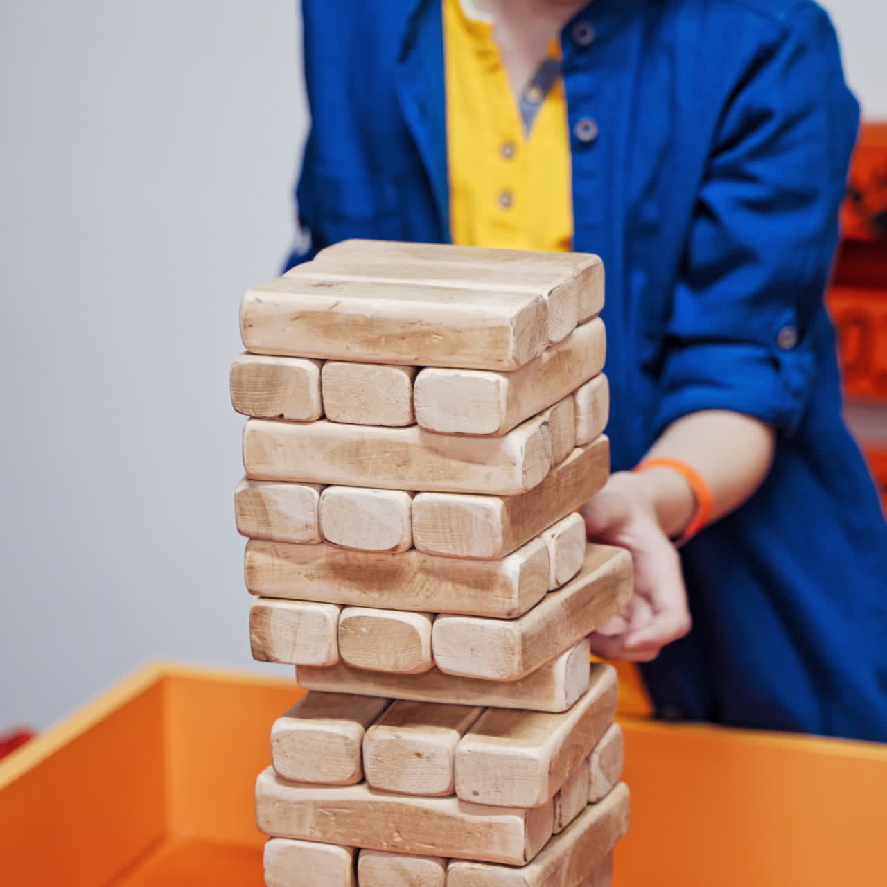 Science exhibition museum. Young boy playing a jenga