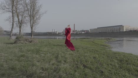 A-dramatic-show-of-a-model-wearing-vibrant-red-dress-from-behind