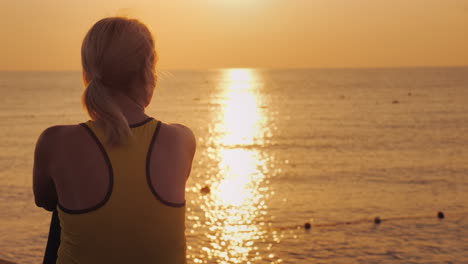 Morning-By-The-Sea---A-Woman-Wrapped-In-A-Towel-Meets-The-Sunrise