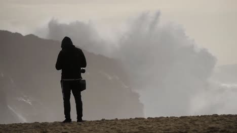 slow motion of a wave break on the beach in nazaré, portugal