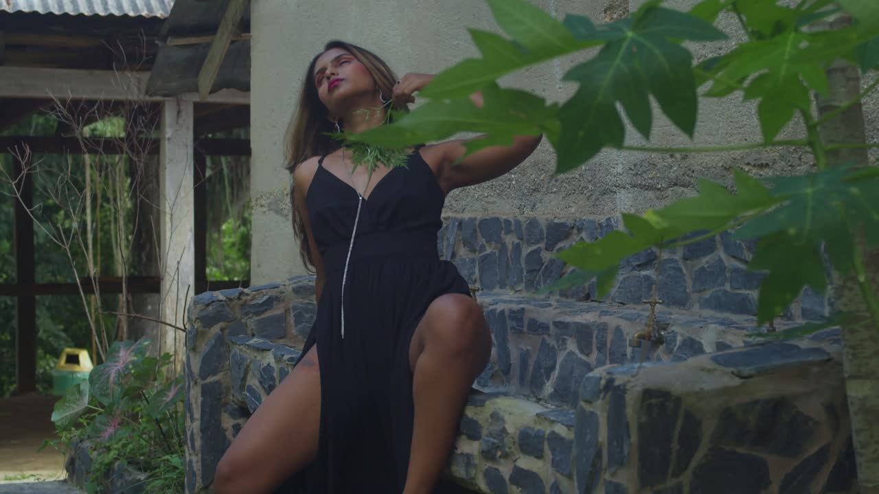 A young girl in a black outfit visiting an ancient complex.