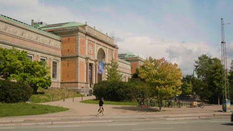 View-Of-National-Gallery-Of-Denmark-In-Copenhagen-With-Man-And-Traffic-On-Street-In-Foreground