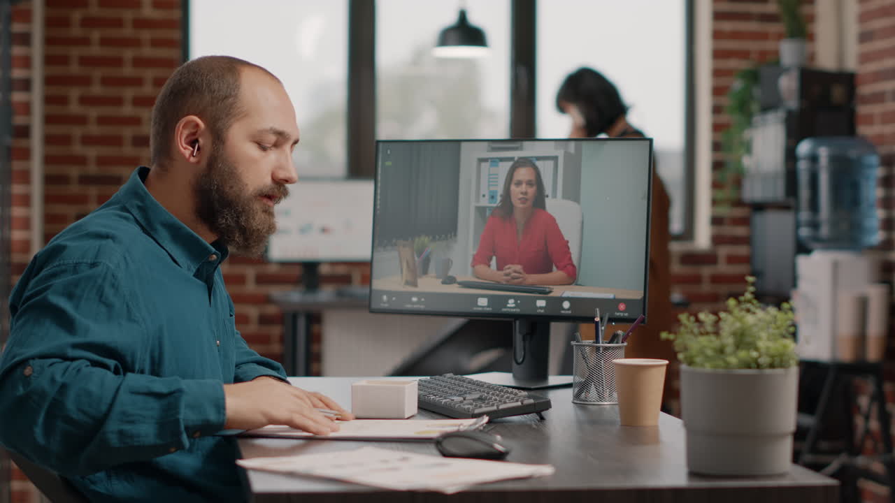 Man on a video call in an office setting