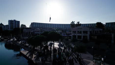 Man-hanging-in-wires-in-the-air-on-drone-shot