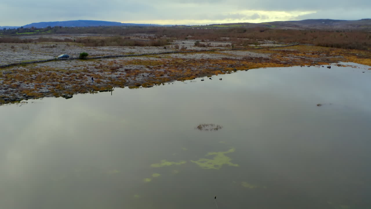 Dynamic aerial shot showcasing a seasonal lake, part of Burren's groundwater network