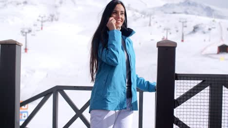 attractive young woman at a mountain ski resort