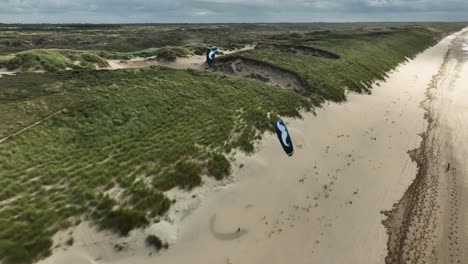 paragliding over sand dunes and beach