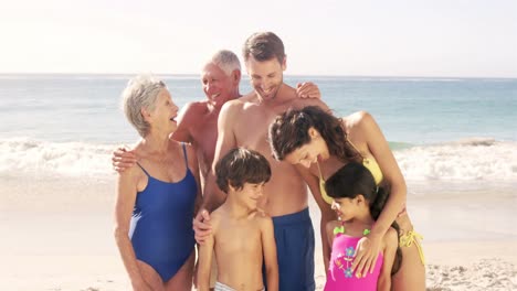 Cute-family-standing-on-the-beach