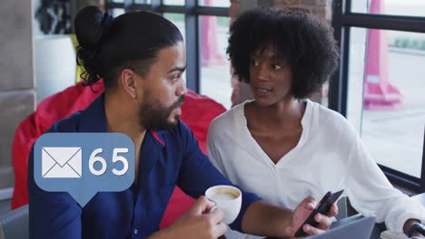 Video-of-social-media-icons-of-over-diverse-man-and-woman-in-restaurant