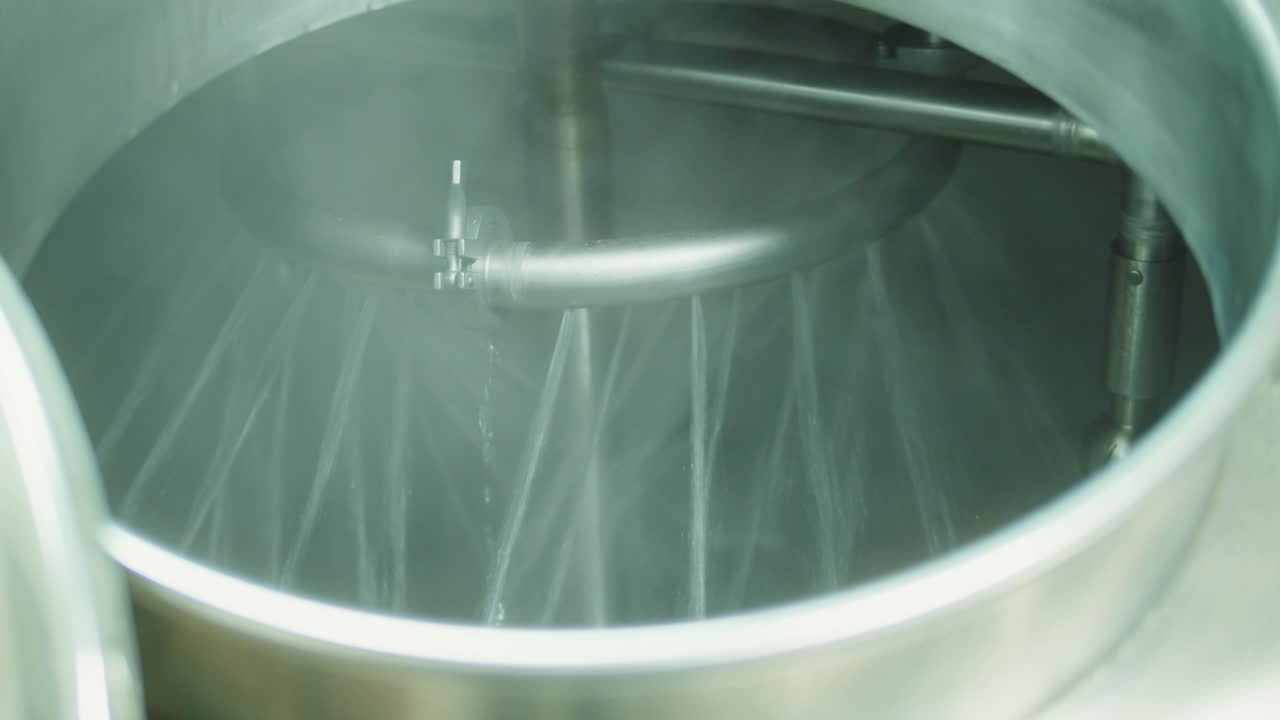 Craft beer production factory, brewery manufacture, cooking alcohol in metal vats bottles