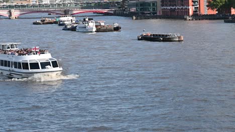 mercuria boat with a british flag, london, united kingdom