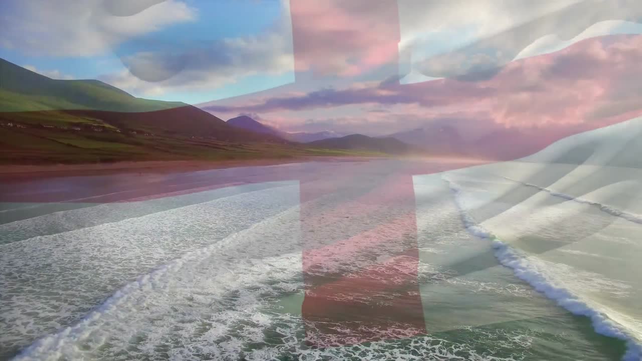 composición digital de la bandera de inglaterra ondeando contra la vista aérea de la playa y las olas del mar