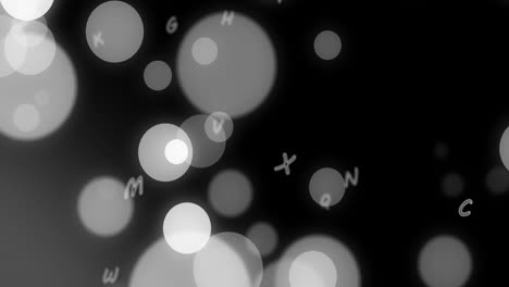 animation of glowing light spots and letters moving over black background