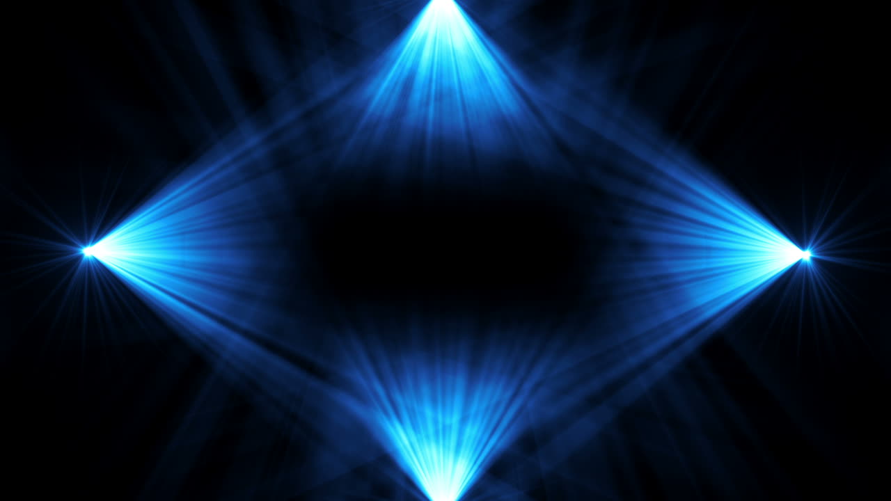 Riflettori dinamici che cambiano colore su uno sfondo scuro.