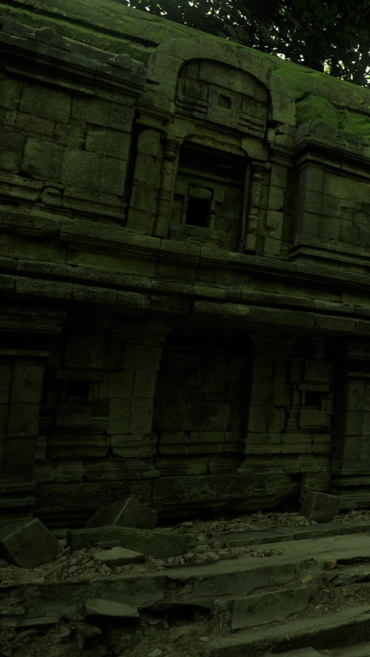 Ancient ruins draped in vines reveal secrets of the past in a serene forest