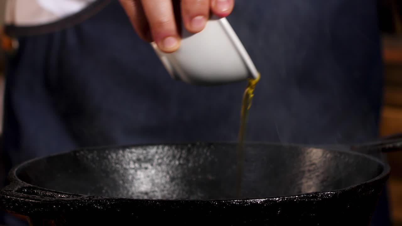 Chef Preparing Food in a Cast Iron Pan