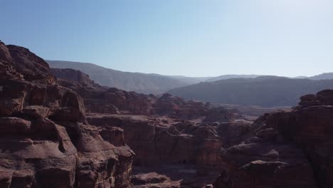 Drone-flying-through-a-canyon-in-the-ancient-city-of-Petra-in-Jordan