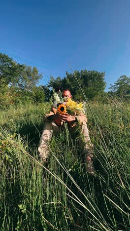 man with flowers in a meadow