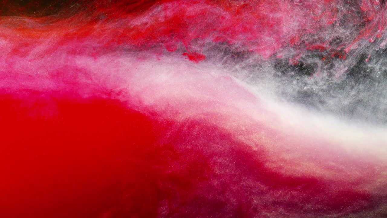 Abstract forms. Shooting on a black background. Mixing of paints