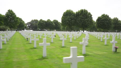 wide moving shot of rows of white crosses at the netherlands american cemetery and memorial in margraten, holland