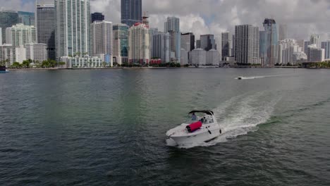 aerial view around guys in a boat, driving off the coast of miami skyline-2