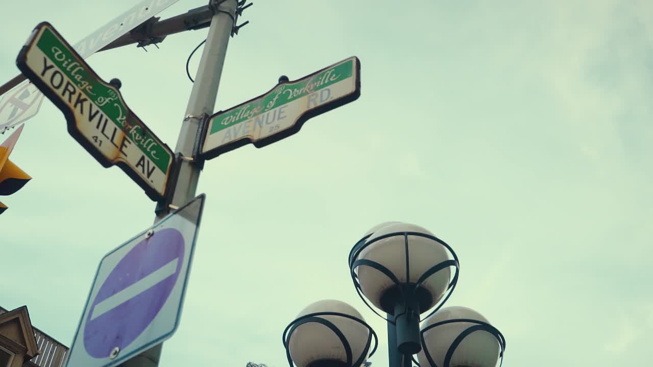 Cross Street Sign of Yorkville Ave and Avenue Road in Toronto