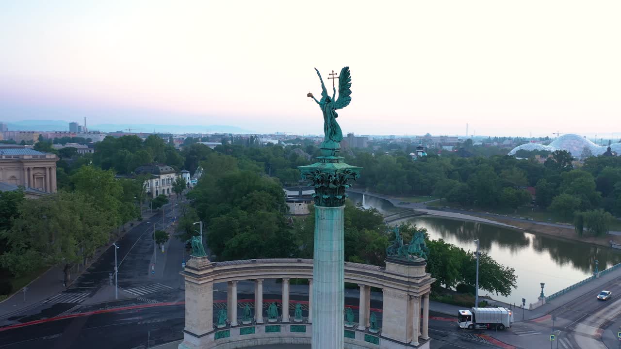 Drone footage of the empty Heroe's Square in Budapest, Hungary at the time of the Covid virus. Early morning at the sunrise in spring.
Drone circles right.