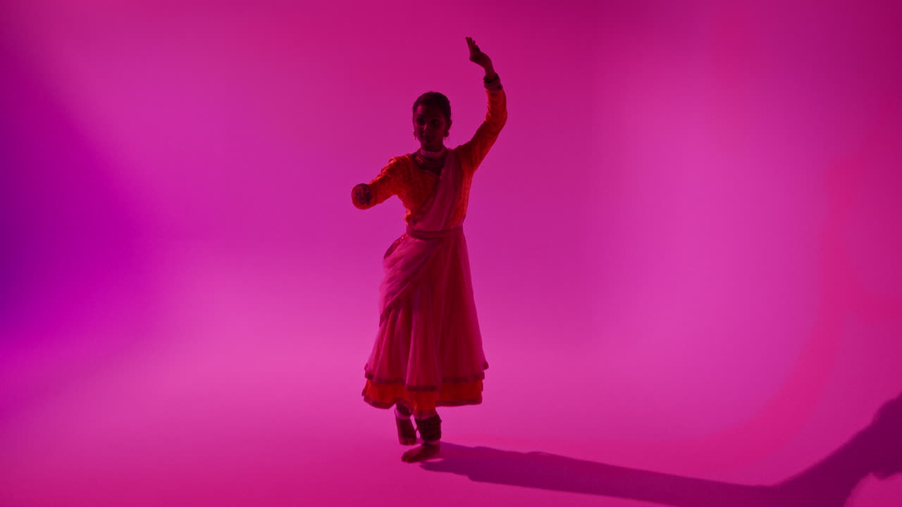 Camera Moves Through Studio Equipment To Show Female Kathak Dancer Wearing Traditional Indian Dress Dancing 1
