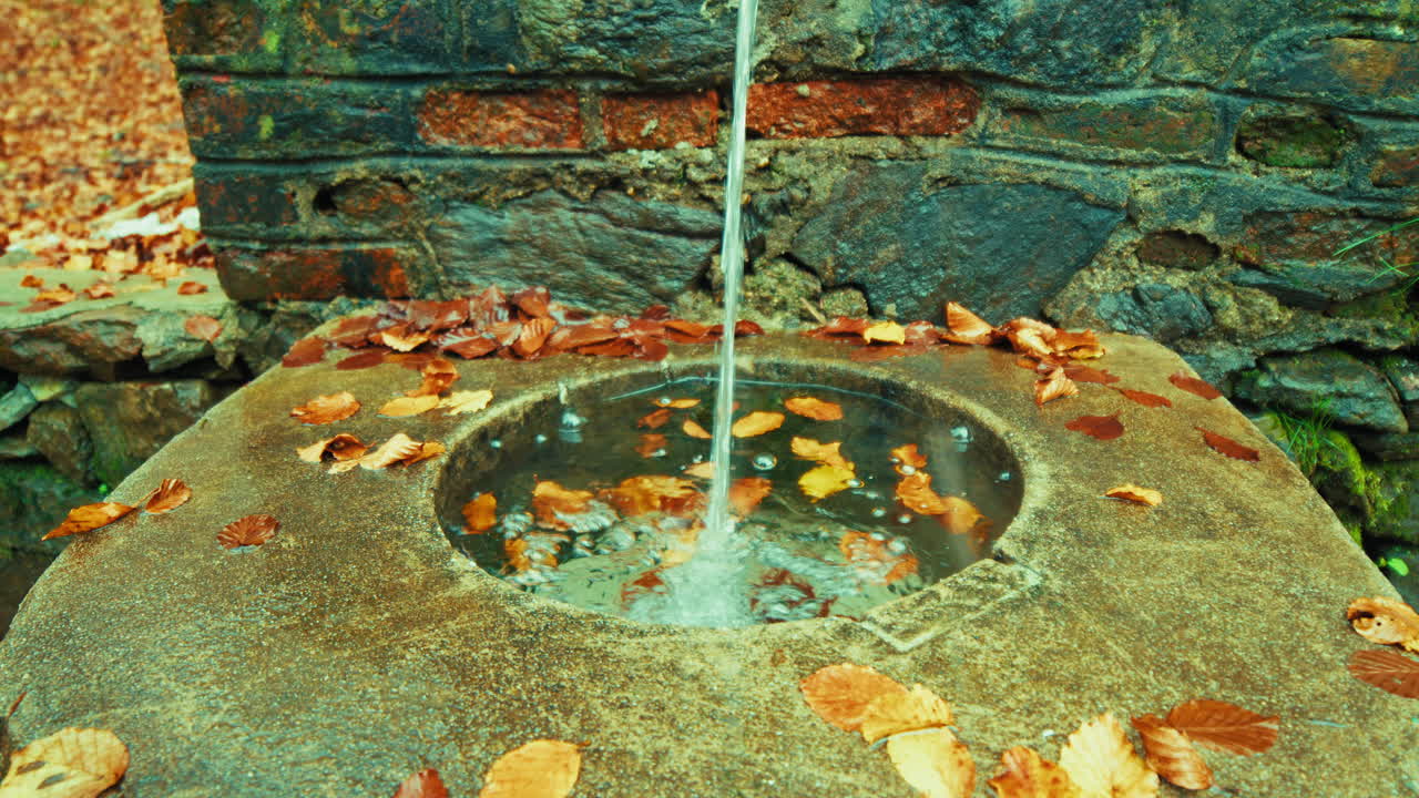 Mountain Fountain With Clear And Healthy Water Flows In Autumn Season