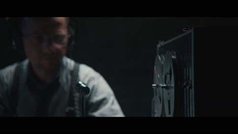 an intelligence officer listens to the wiretap recordings
