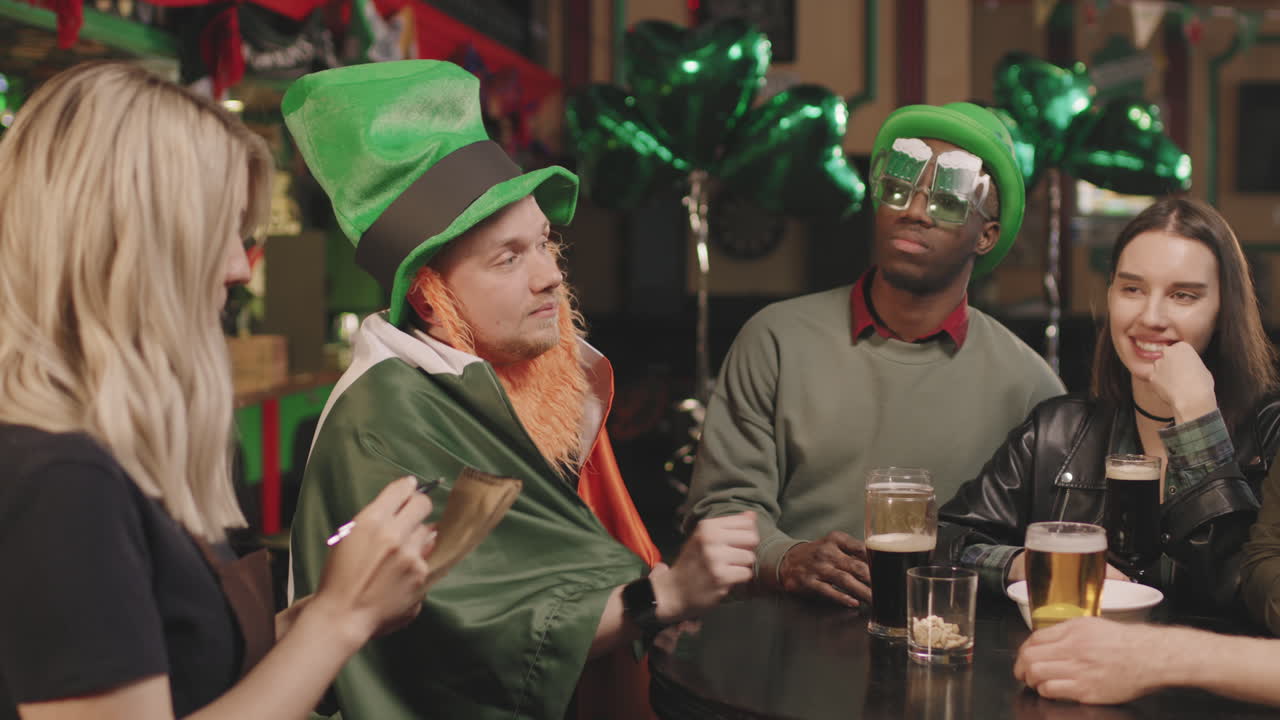 Friends Making Order In Irish Pub