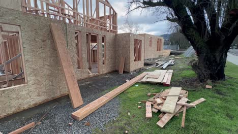 still shot of a construction site with wood framing all around