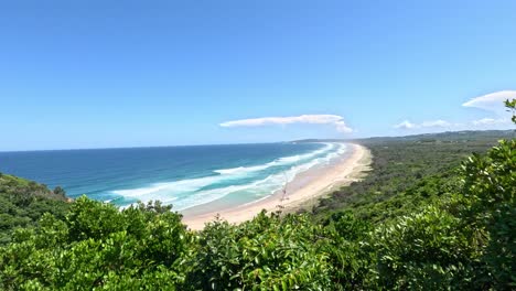 panoramic view of a beach and ocean from a high vantage point.