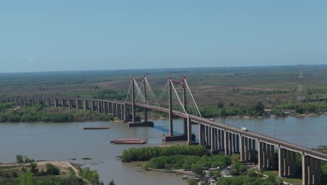 aerial view of a long cable-stayed bridge over a river