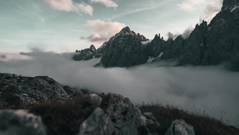 Fog-is-rising-up-a-pristine-mountain-valley-in-the-Italian-Alps-during-sunset